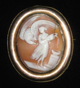 A Victorian nicely carved shell cameo brooch, depicting Hebe and Zeus as an eagle, from Roman mythology.