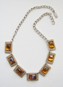 image of a vintage west germany necklace, made in eloxal metal and decorated with large rectangular faceted glass stones